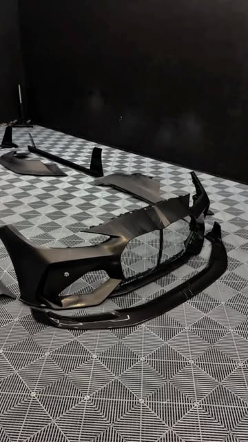 Close-up of carbon-fibre ADRO bumper and bodykit components